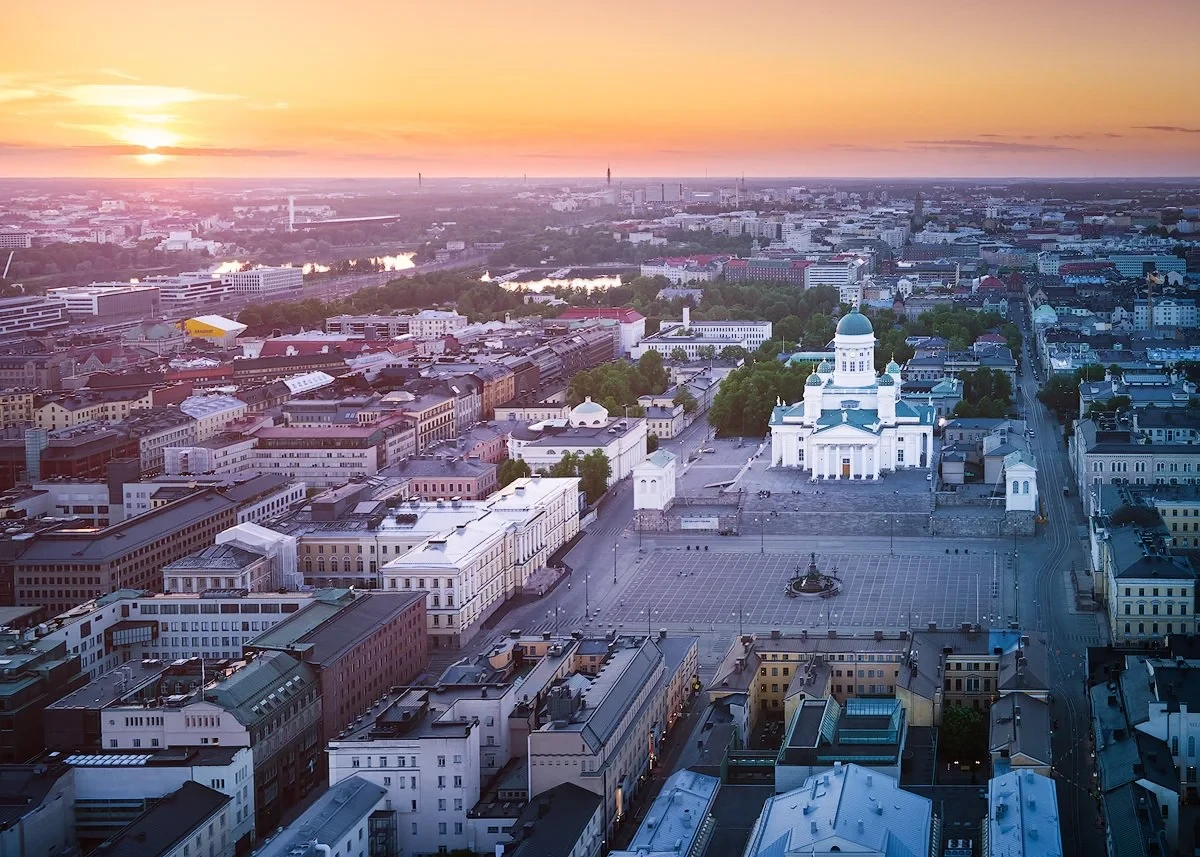 Aerial view of Helsinki Cathedral and cityscape at sunset.