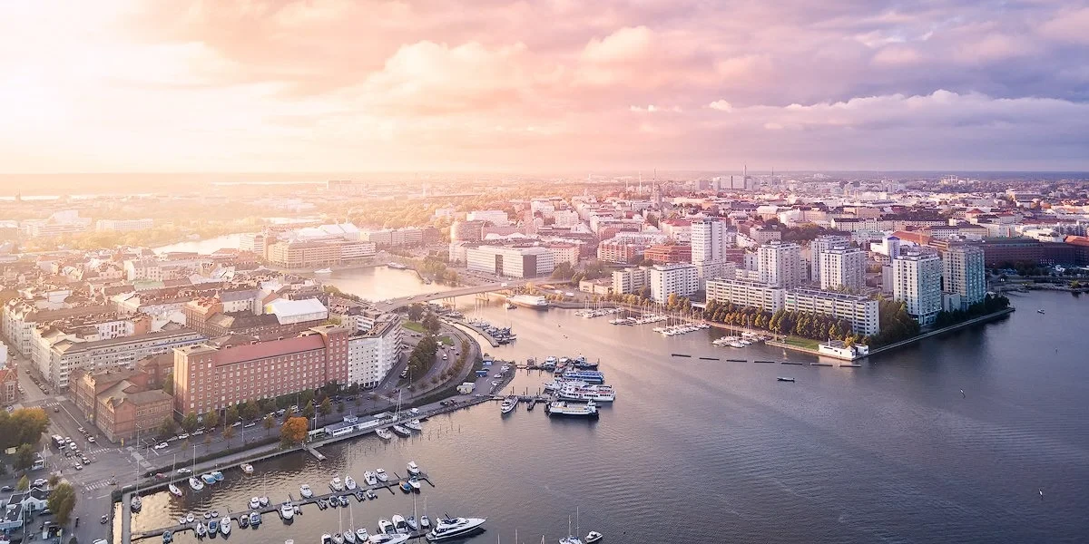 Aerial view of a cityscape with buildings and water